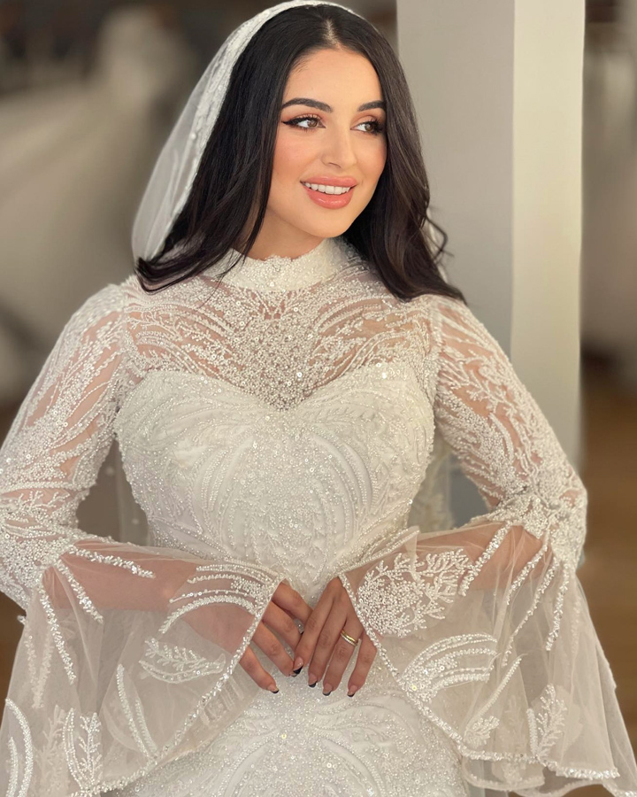 فستان عروسه ابيض طويل مطرز بالخرز والترتر اللامع قصة حورية البحر و بأكمام فضفاضه طويلة